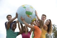 Group of young people holding a globe earth Stock Images