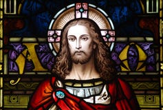 Jesus Christ in stained glass (the beginning and the end) Stock Images