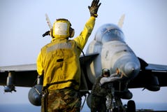 F-18 Hornet and Sailors Royalty Free Stock Images