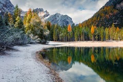 First snow on Braies Lake. Royalty Free Stock Images