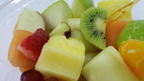 Fress fruit salad on white table Stock Photo