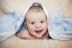 happy-baby-under-blanket-smiling-boy-peeking-blue-37433095.jpg