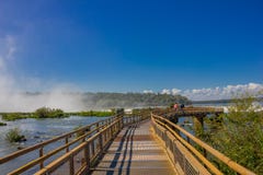 IGUAZU, ARGENTINA - MAY 14, 2016: bridge thats goes to the devils throath located in the argentinian border of the falls Royalty Free Stock Photo